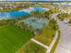 Community tennis courts with surrounding green space at 14350 Easy Goer St, Ruskin, FL 33573