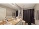 Clean bathroom with double vanity and shower/tub combo at 15812 High Bell Pl, Bradenton, FL 34212