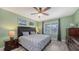 Bright bedroom with a king-size bed, dresser, and large window with natural light at 15812 High Bell Pl, Bradenton, FL 34212