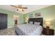 Relaxing bedroom with a king-size bed, ensuite bathroom, and soft color palette at 15812 High Bell Pl, Bradenton, FL 34212