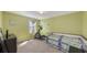 Bedroom with elliptical, daybed, and window seat at 15812 High Bell Pl, Bradenton, FL 34212