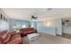 Upstairs bonus room with comfortable seating and plenty of natural light at 15812 High Bell Pl, Bradenton, FL 34212