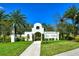 Elegant community entrance with arched gateway and landscaping at 15812 High Bell Pl, Bradenton, FL 34212