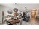 Round dining table with gray chairs, located near the kitchen at 15812 High Bell Pl, Bradenton, FL 34212