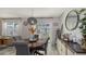 Round dining table with gray chairs, located near the kitchen at 15812 High Bell Pl, Bradenton, FL 34212