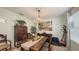 Formal dining room with a wood table, chandelier, and antique furniture at 15812 High Bell Pl, Bradenton, FL 34212