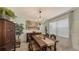 Formal dining room with a wood table, chandelier, and antique furniture at 15812 High Bell Pl, Bradenton, FL 34212