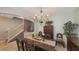 Formal dining room with a wood table, chandelier, and antique furniture at 15812 High Bell Pl, Bradenton, FL 34212