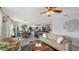 Open concept living room with a view of the kitchen and dining area at 15812 High Bell Pl, Bradenton, FL 34212