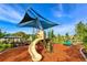 playground with shaded play structure and slide at 15812 High Bell Pl, Bradenton, FL 34212
