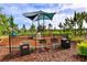 Playground with grills and shaded play area at 15812 High Bell Pl, Bradenton, FL 34212