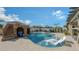 Luxury pool with grotto, slide, and spacious patio at 15812 High Bell Pl, Bradenton, FL 34212