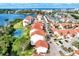 Aerial view of community with waterfront access and tennis court at 1626 Stickney Point Rd # 26-102, Sarasota, FL 34231