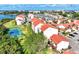 Aerial view of community with oceanfront location and tennis court at 1626 Stickney Point Rd # 26-102, Sarasota, FL 34231