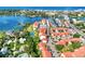 Aerial of community near waterfront, parking, and tennis court at 1626 Stickney Point Rd # 26-102, Sarasota, FL 34231