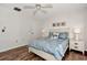 Bedroom with a queen bed, dresser, and ceiling fan at 1626 Stickney Point Rd # 26-102, Sarasota, FL 34231