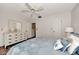 Bedroom with a queen bed, dresser, and ceiling fan at 1626 Stickney Point Rd # 26-102, Sarasota, FL 34231