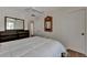 Bedroom with a queen bed, dresser, and ceiling fan at 1626 Stickney Point Rd # 26-102, Sarasota, FL 34231