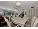 Dining area with white table and chairs near living room at 1626 Stickney Point Rd # 26-102, Sarasota, FL 34231