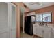 Modern kitchen with stainless steel appliances and white cabinetry at 1626 Stickney Point Rd # 26-102, Sarasota, FL 34231