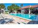 Inviting community pool with plenty of lounge chairs at 1626 Stickney Point Rd # 26-102, Sarasota, FL 34231