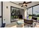 Screened porch with access to the backyard and patio at 1626 Stickney Point Rd # 26-102, Sarasota, FL 34231