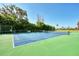 Well-maintained tennis court with green surface and white lines at 1626 Stickney Point Rd # 26-102, Sarasota, FL 34231