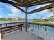 Relaxing waterfront gazebo with seating, offering scenic views at 1626 Stickney Point Rd # 26-102, Sarasota, FL 34231