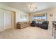 Relaxing living room featuring comfy seating and large windows at 16499 Becasse Dr, Punta Gorda, FL 33955