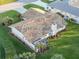 Aerial view of house, highlighting the backyard and patio at 1726 Killdeer Cir, Venice, FL 34293