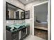 Modern bathroom with double vanity and glass sink at 1726 Killdeer Cir, Venice, FL 34293