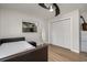 Bright bedroom with a bed, large closet, and hardwood floors at 1726 Killdeer Cir, Venice, FL 34293