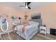 Cozy bedroom with a bed, desk, and floor-to-ceiling closet at 1726 Killdeer Cir, Venice, FL 34293