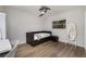 Spacious bedroom with a daybed, full-length mirror, and hardwood floors at 1726 Killdeer Cir, Venice, FL 34293