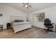Main bedroom with a king-size bed and an office area at 1726 Killdeer Cir, Venice, FL 34293