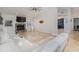 Spacious living room with a stone fireplace and large sectional sofa at 1726 Killdeer Cir, Venice, FL 34293