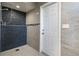 Walk-in shower with stone tile and exterior access at 1726 Killdeer Cir, Venice, FL 34293