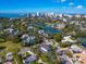 Aerial view showing a house nestled in a neighborhood near the water at 1810 Lincoln Dr, Sarasota, FL 34236