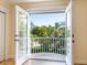Private balcony overlooking lush tropical landscape at 1810 Lincoln Dr, Sarasota, FL 34236