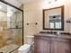 Bathroom features a walk-in shower and granite vanity at 1810 Lincoln Dr, Sarasota, FL 34236
