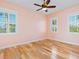 Light pink bedroom with hardwood floors and plantation shutters at 1810 Lincoln Dr, Sarasota, FL 34236