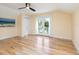 Bedroom with hardwood floors, French doors to balcony, and ocean view at 1810 Lincoln Dr, Sarasota, FL 34236