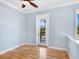 Light and airy bedroom with hardwood floors and private balcony access at 1810 Lincoln Dr, Sarasota, FL 34236