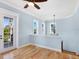 Light and airy bedroom with hardwood floors and private balcony access at 1810 Lincoln Dr, Sarasota, FL 34236
