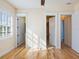 Bright bedroom with hardwood floors and access to two bathrooms at 1810 Lincoln Dr, Sarasota, FL 34236