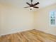 Spacious bedroom with hardwood floors and a ceiling fan at 1810 Lincoln Dr, Sarasota, FL 34236