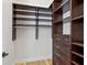 Walk-in closet with ample shelving and a hanging rod at 1810 Lincoln Dr, Sarasota, FL 34236