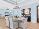 Light and airy dining room features a large table and hardwood floors at 1810 Lincoln Dr, Sarasota, FL 34236
