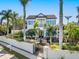 Two-story house with a white exterior, blue shutters, and a fountain in the front yard at 1810 Lincoln Dr, Sarasota, FL 34236