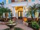 Elegant entryway with fountain and double doors at 1810 Lincoln Dr, Sarasota, FL 34236